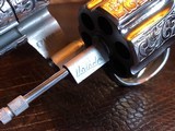 Colt Python .357 Magnum - Master Engraver Robert Valade - 4” - Nickel -
Deep Western Scroll Engraving - Like New - 24 of 25