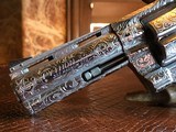 Colt Python .357 Magnum - Master Engraver Robert Valade - 4” - Nickel -
Deep Western Scroll Engraving - Like New - 25 of 25