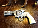 Colt Python .357 Magnum - Master Engraver Robert Valade - 4” - Nickel -
Deep Western Scroll Engraving - Like New - 4 of 25