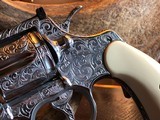 Colt Python .357 Magnum - Master Engraver Robert Valade - 4” - Nickel -
Deep Western Scroll Engraving - Like New - 11 of 25