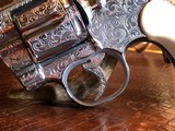 Colt Python .357 Magnum - Master Engraver Robert Valade - 4” - Nickel -
Deep Western Scroll Engraving - Like New - 23 of 25