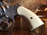 Colt Python .357 Magnum - Master Engraver Robert Valade - 4” - Nickel -
Deep Western Scroll Engraving - Like New - 6 of 25