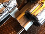 Colt Python .357 Magnum - Master Engraver Robert Valade - 4” - Nickel -
Deep Western Scroll Engraving - Like New - 20 of 25