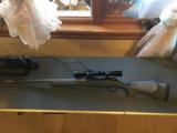 Weatherby Rifle Mark V light weight in 308, stainless steel, with Leupold Var XII 3X9 X50 scope - 1 of 9