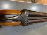 Ithaca 200 E side by side shotgun, 26 inch barrel, hi condition, used little with wrap around wood - 1 of 15