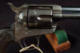 079-0916-3095, Colt SA Frontier Six Shooter, 75% deep overall blue, crisp excellent grips. 60% rainbow hues,
- 12 of 15