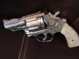 Smith & Wesson 66-4,Jeff Flannery master engraved,100%+coverage,polished stainless MOP grips,357 Mag,2 1/2