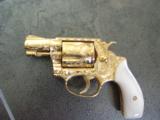 Smith & Wesson Model 36 no dash,master scroll engraved by Jeff Flannery,24K plated,1
3/4