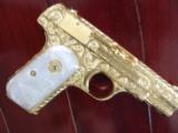 Colt 1903,32auto,24K gold plated,100%+ deep master engraved by Jeff Flannery,Pearlite grips,1941,hammerless grip safety,awesome one of a kind
!! - 1 of 12