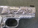 Colt Defender 45acp,fully engraved by Flannery,polished stainless slide,3