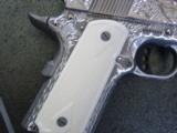 Colt Defender 45acp,fully engraved by Flannery,polished stainless slide,3