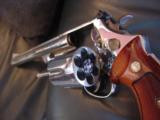 Smith & Wesson Model 29-2, 44 Magnum,8 3/8",bright high polished nickel,Bianchi leather holster,wood grips,around 1969,a nice clean showpiece !! - 10 of 12