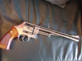 Smith & Wesson Model 29-2, 44 Magnum,8 3/8",bright high polished nickel,Bianchi leather holster,wood grips,around 1969,a nice clean showpiece !! - 4 of 12