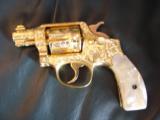 Smith & Wesson Pre Model 10,100%+ Master engrave by Flannery,24K gold plated,2",38spl,real MOP grips,a work of art - 2 of 12