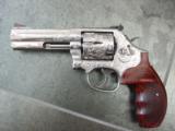Smith & Wesson 686-6,fully engraved by Flannery,polished stainless,custom Rosewood grips,4