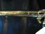 The Samuel Colt Golden Tribute Buntline,factory engraved,12