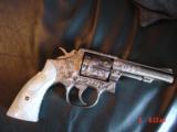 Smith & Wesson,model 10-8,fully engraved by Flannery & refinished in bright nickel,4