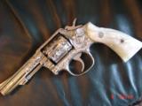 Smith & Wesson,model 10-8,fully engraved by Flannery & refinished in bright nickel,4