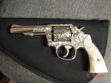 Smith & Wesson,model 10-8,fully engraved by Flannery & refinished in bright nickel,4