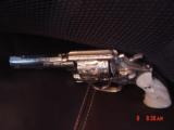 Smith & Wesson,model 10-8,fully engraved by Flannery & refinished in bright nickel,4