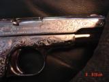 Colt 1903, 32 calibur,fully engraved,& refinished in bright nickel,bonded ivory grips,hammerless,grip safety,made in 1916,an awesome show piece !! - 5 of 15