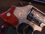 Smith & Wesson,686-6,fully engraved by Flannery Engraving,custom Rosewood grips,4