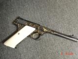 Colt Woodsman,master engraved by Jim Sorenberger with 24K Eagles & gold inlays,real Ivory grips,6