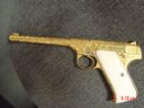 Colt The Woodsman,fully master Cattlebrand engraved by Flannery,24K gold plated,real creamy ivory grips,1943,6 3/4