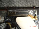 Colt Woodsman 1926 !! master engraved by Jim Sornberger,24k inlays,gold & silver rabbits,high gloss blued,6 1/2