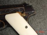 Colt Woodsman 1940, master leaf engraved by Jim Sornberger,reblued high gloss,heavy gold inlays,real ivory grips,silver 3D squirrel,6 1/2