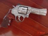 Smith & Wesson 686,no dash,fully engraved by Flannery,custom Rosewood grips,high polished stainless,4