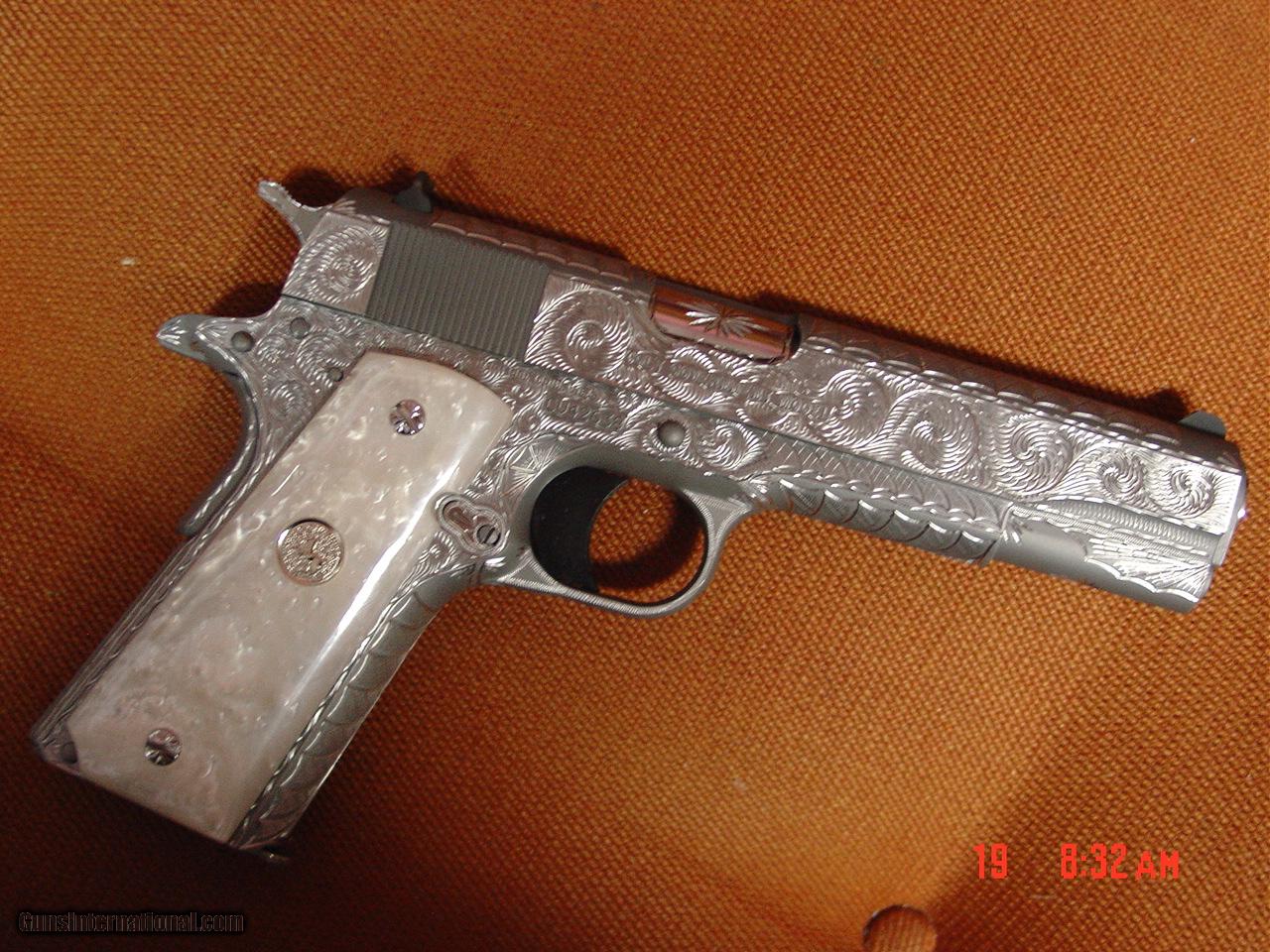 Colt Government 1911,fully engraved by Flannery engraving, 2 maga,45acp,5  barrel,Pearlite grips & originals,in case with papers,a real masterpiece !