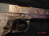 Colt Government Series 80,38 Super,Master engraved by S,Leis,refinished bright nickel with 24K gold accents,custom grips,2 mags,a work of art-awesome
- 10 of 15