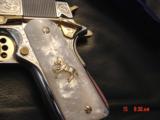 Colt Government Series 80,38 Super,Master engraved by S,Leis,refinished bright nickel with 24K gold accents,custom grips,2 mags,a work of art-awesome
- 3 of 15