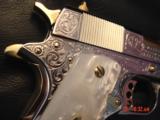 Colt Government Series 80,38 Super,Master engraved by S,Leis,refinished bright nickel with 24K gold accents,custom grips,2 mags,a work of art-awesome
- 11 of 15