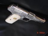 Colt 1903 hammerless,32 cal,master engraved by S.Leis,refinished nickel,1915,bonded ivory grips,awesome showpiece !! - 13 of 15