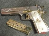 Colt Government 1911,38 Super,Master engraved by Santiago Leis,refinished bright nickel & 24K gold accents,Pearlite grips,awesome work of art
- 4 of 12