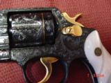 Smith & Wesson 10-5,38spl.fully engraved & reblued by Flannery Engraving,with 24K accents & gold inlay,2