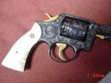 Smith & Wesson 10-5,38spl.fully engraved & reblued by Flannery Engraving,with 24K accents & gold inlay,2