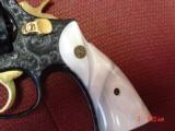 Smith & Wesson 10-5,38spl.fully engraved & reblued by Flannery Engraving,with 24K accents & gold inlay,2