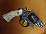 Smith & Wesson 10-5,38spl.fully engraved & reblued by Flannery Engraving,with 24K accents & gold inlay,2
