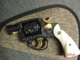 Smith & Wesson 10-5,38spl.fully engraved & reblued by Flannery Engraving,with 24K accents & gold inlay,2