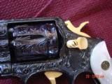 Smith & Wesson 10-7,fully engraved,& reblued with 24k accents by Flannery engraving,Pearlite grips,4",38spl.,awesome work of art !! - 2 of 15