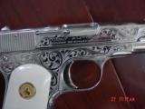 Colt 1903,32 cal,made 1920,master engraved by S.Leis,& refinished in bright mirror nickel,bonded ivory grips.awesome showpiece - 3 of 15
