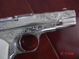 Colt 1903,32 cal,made 1920,master engraved by S.Leis,& refinished in bright mirror nickel,bonded ivory grips.awesome showpiece - 4 of 15