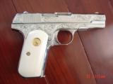 Colt 1903,32 cal,made 1920,master engraved by S.Leis,& refinished in bright mirror nickel,bonded ivory grips.awesome showpiece - 1 of 15