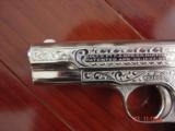 Colt 1903,32 cal,made 1920,master engraved by S.Leis,& refinished in bright mirror nickel,bonded ivory grips.awesome showpiece - 7 of 15