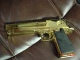 Magnum Research Desert Eagle 50AE,in the rare bright Titanium gold,6", a real showpiece hand cannon,never fired,in case with all papers & DVD,MK
- 14 of 15