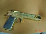 Magnum Research Desert Eagle 50AE,in the rare bright Titanium gold,6", a real showpiece hand cannon,never fired,in case with all papers & DVD,MK
- 15 of 15