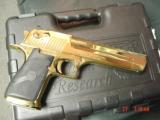 Magnum Research Desert Eagle 50AE,in the rare bright Titanium gold,6", a real showpiece hand cannon,never fired,in case with all papers & DVD,MK
- 9 of 15